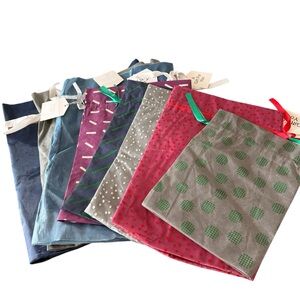 Lot of 8 Drawstring Fabric Holiday Gift Bags of various sizes, from Amazon